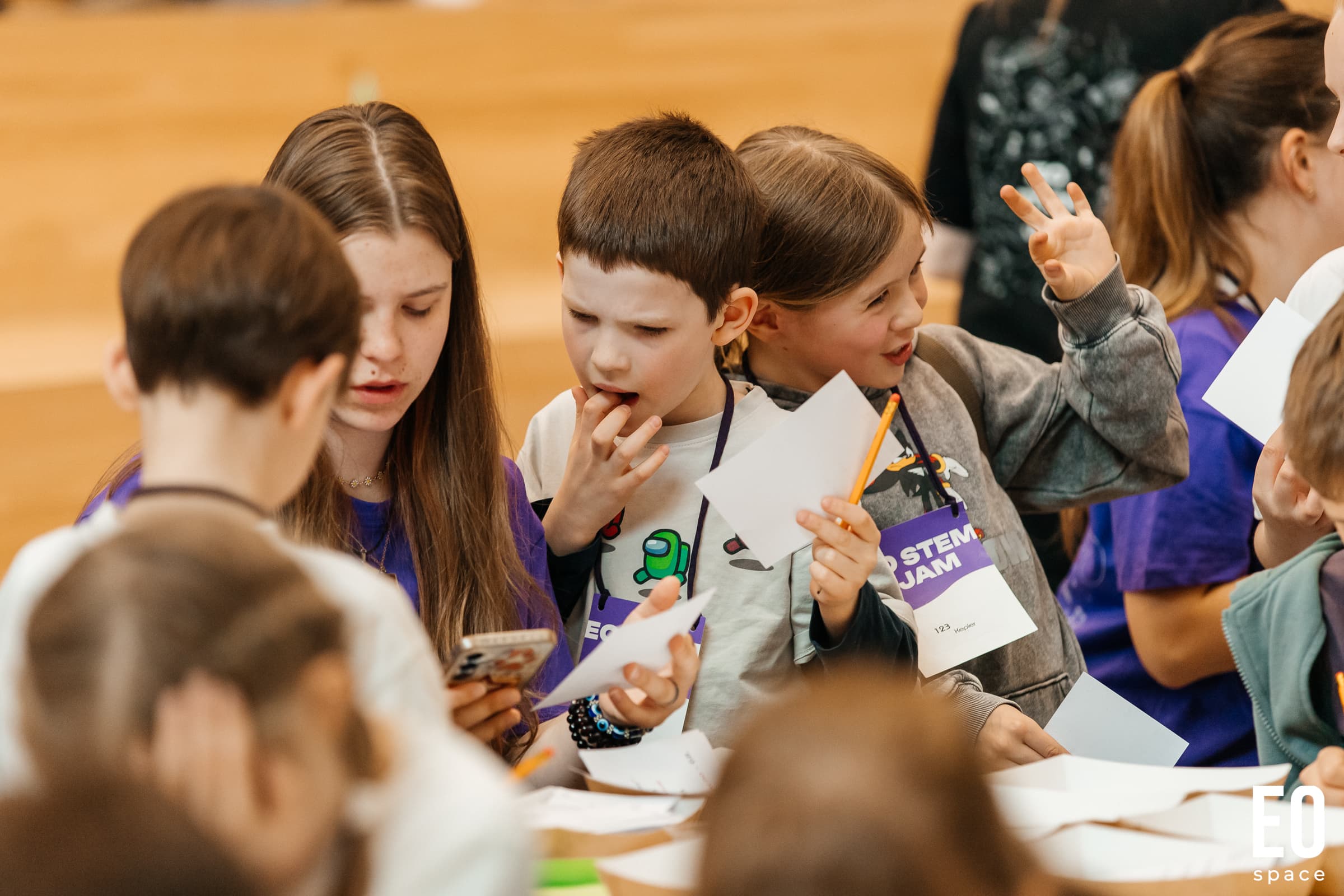 Children writing at EO STEM Jam
